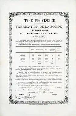 Certificato globale per 100 obbligazioni n. 1-100 della Société Solvay & Cie. a 500 franchi ciascuna, emesso il 1º maggio 1874 a favore di Ernest Solvay e da lui personalmente firmato in qualità di direttore generale. L'obbligazione con un interesse del 6% per un importo totale di 600.000 franchi è stata sottoscritta per la costruzione di una fabbrica a Dombasle-sur-Meurthe in Francia.