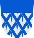 D'argento, cancellato ad erpice d'azzurro, al capo dello stesso (Ylihärmä, Finlandia)