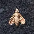 Ape d'oro con piccole sferule intarsiate in oro